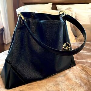 Black Michael Kors medium shoulder bag.